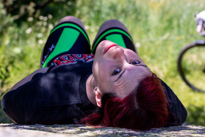 Portrait of girl lying down on land