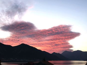 Scenic view of silhouette mountains against sky during sunset