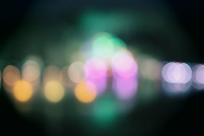 Defocused image of illuminated lights at night