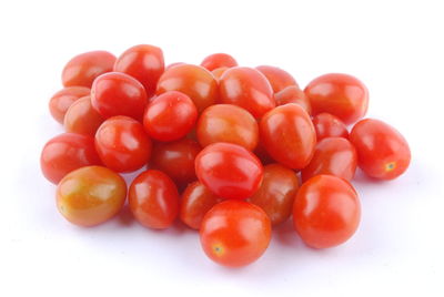 Close-up of tomatoes against white background