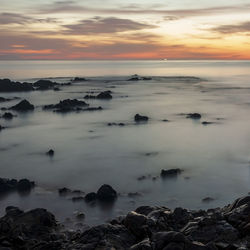 Scenic view of sea against sky during sunset