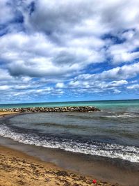 Scenic view of beach against sky