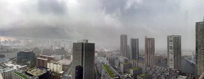 Cityscape against cloudy sky