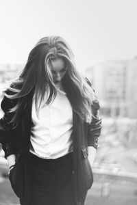 Beautiful woman standing in the dark