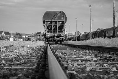 Train on railroad track against sky