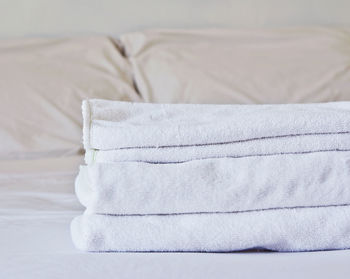 Close-up of towels on bed