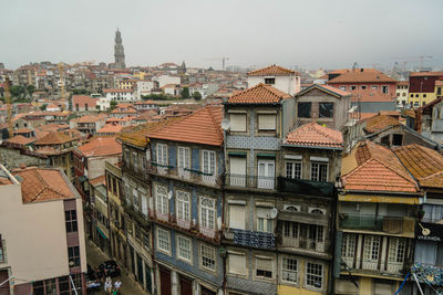 High angle view of residential buildings against sky