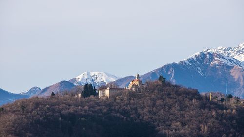 Scenic view of snowcapped mountains against clear sky