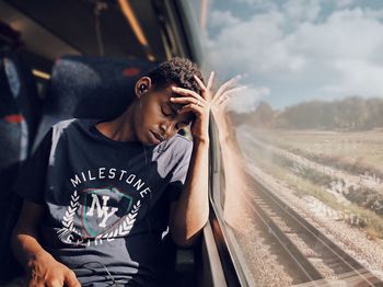 Portrait of teenage boy in train