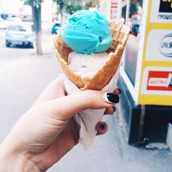 Cropped hand holding ice cream