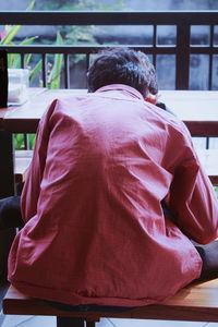 Rear view of couple sitting on seat