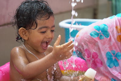 Close-up of girl playing in water