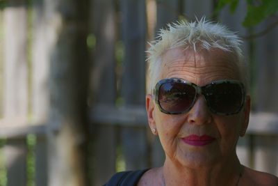 Blond grandmother portrait portrait of woman wearing sunglasses