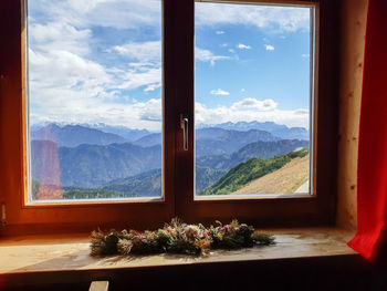 Scenic view of mountains seen through window