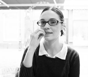 Portrait of woman with finger in mouth