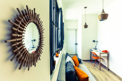 Low section of person on sofa at home