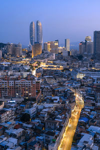 High angle view of city buildings at dusk