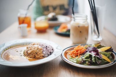 Close-up of food served in plates on table