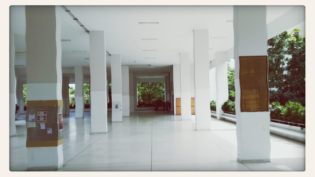 architecture, indoors, built structure, transfer print, corridor, tiled floor, flooring, auto post production filter, architectural column, empty, door, column, building, the way forward, sunlight, building exterior, window, day, absence, no people