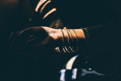 Cropped image of woman wearing bangles