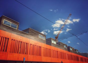 Low angle view of buildings against blue sky