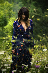 Young woman standing on field