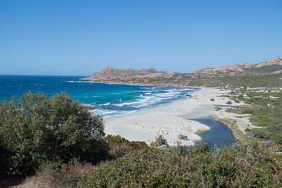 Scenic view of sea against clear blue sky