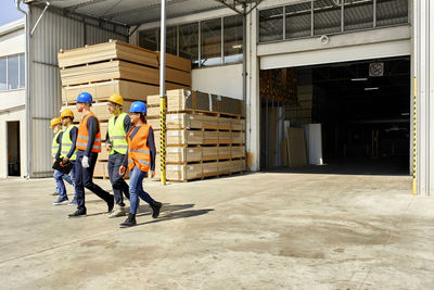 Group of workers walking on factory yard