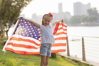 Woman holding american flag