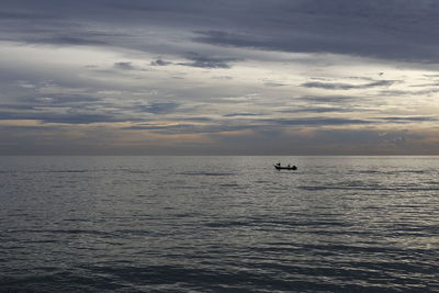 Scenic view of sea against dramatic sky