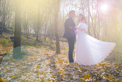 Couple kissing in forest