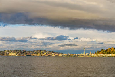 Panoramic view of sea and buildings against sky