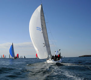 Sailboat on sea against clear sky