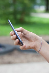 Close-up of hand holding smart phone