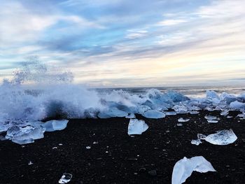 Scenic view of sea against sky during winter