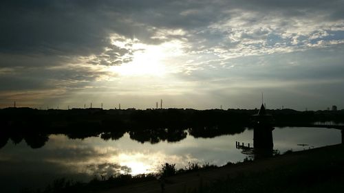 Scenic view of lake at sunset