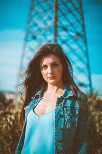 Portrait of beautiful young woman standing outdoors