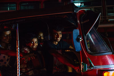 Portrait of a young man sitting in car