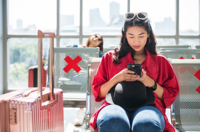 Young woman using mobile phone