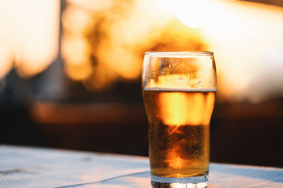 Close-up of beer glass on table