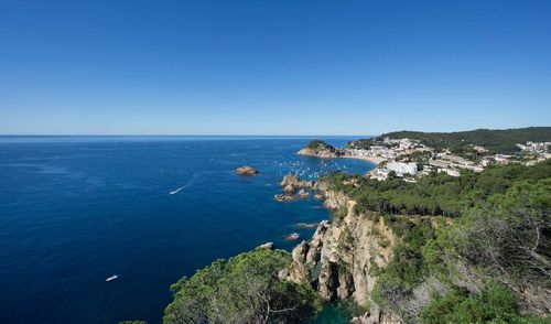 High angle view of sea against blue sky