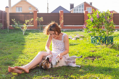 Full length of a woman with dog