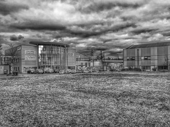 Houses against cloudy sky