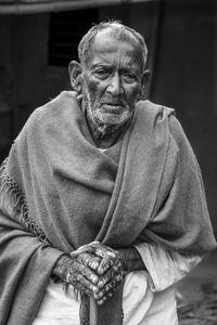 Portrait of senior man standing outdoors