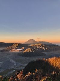 View of volcanic landscape against sky during sunset