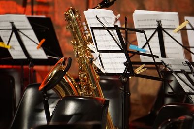 Close-up of saxophone on stage during concert