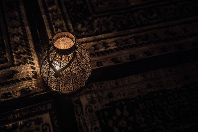 High angle view of hat hanging on wood at home