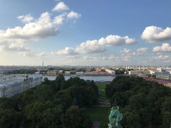 High angle view of buildings and river against sky