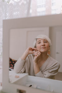 Portrait of a young woman looking at home