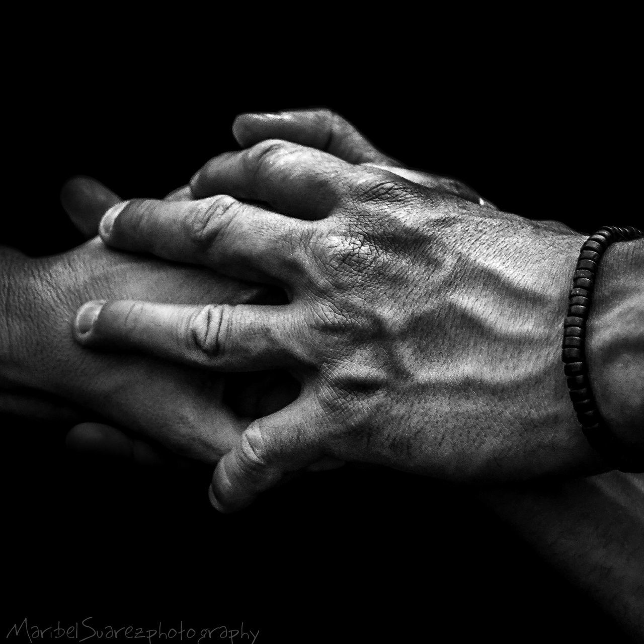 person, part of, indoors, human finger, cropped, close-up, men, black background, holding, lifestyles, studio shot, unrecognizable person, leisure activity, midsection, togetherness